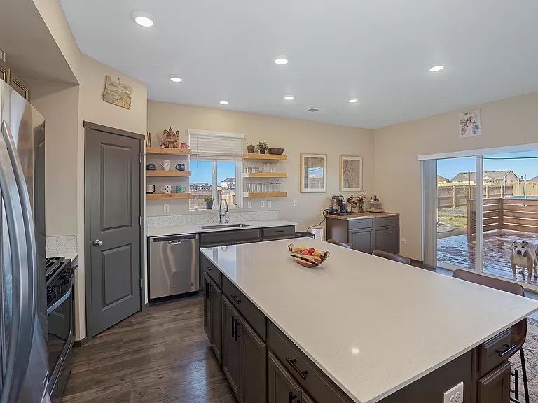 Kitchen with a large island and gray cabinets